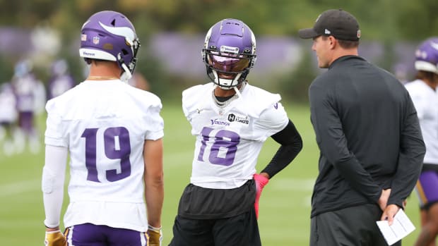 Jul 28, 2022; Minneapolis, MN, USA; Vikings head coach Kevin O’Connell and wide receivers Justin Jefferson (18) and Adam Thielen (19) talk during training camp at TCO Performance Center.